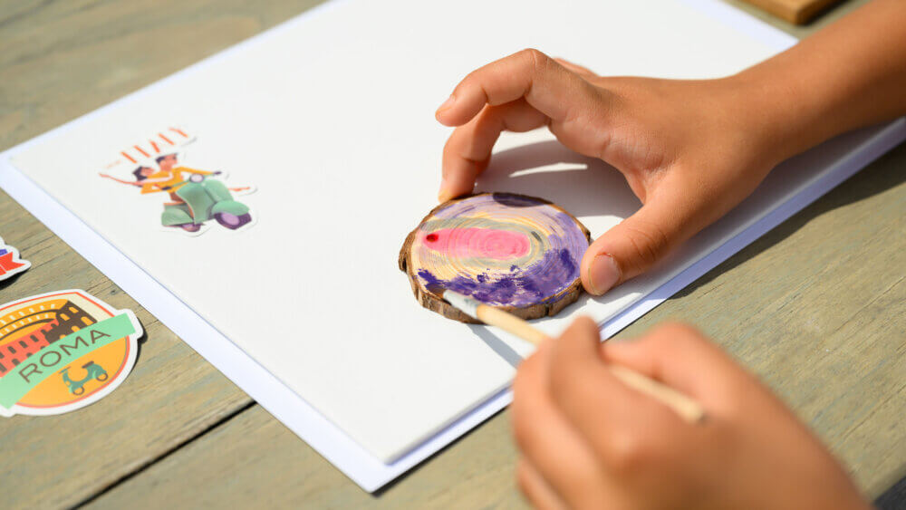 Child enjoying a creative travel activity while on vacation