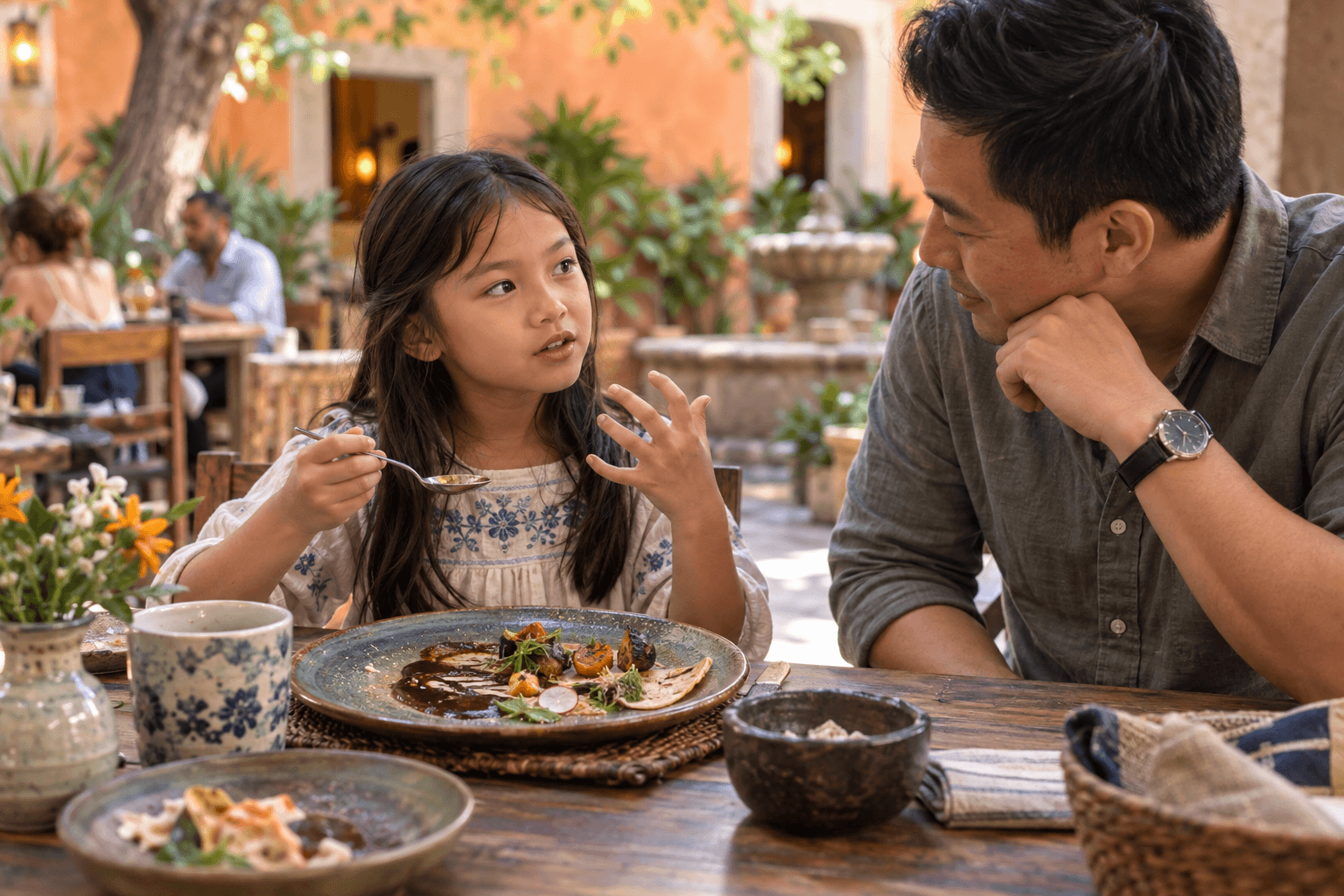 A child’s thoughtful Oaxaca food review A child describes the flavors of a new local dish while her father listens to her review.